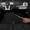 Дитячий двомісний повнопривідний електромобіль Bambi Mercedes AMG G63 (MP3) з ручкою для транспортування та автофарбуванням, чорний