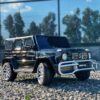 Дитячий двомісний повнопривідний електромобіль Bambi Mercedes AMG G63 (MP3) з ручкою для транспортування та автофарбуванням, чорний