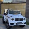 Дитячий електромобіль Bambi Mercedes G63 AMG (MP3) з ручкою для транспортування, білий