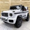 Дитячий електромобіль Bambi Mercedes G63 AMG (MP3) з ручкою для транспортування, білий